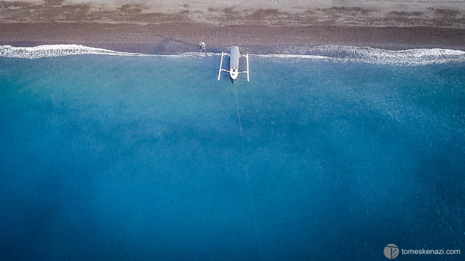 Lone boat on Amed Beach, Bali, Indonesia