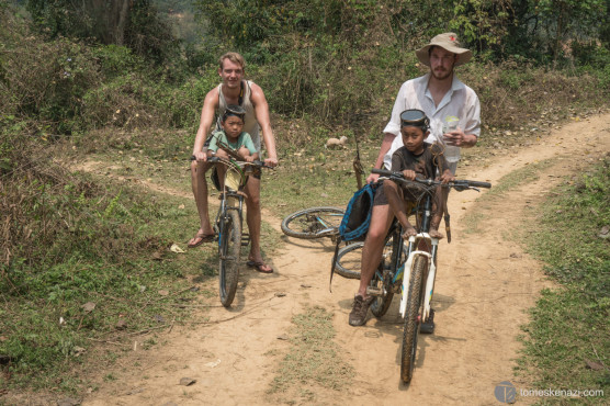 Helping locals to get back home, near Muang Ngoi, Laos