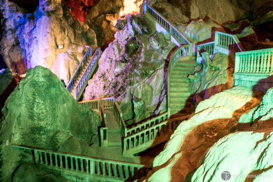 Modern lighting and sculpture in natural cave, Thakek area, Laos