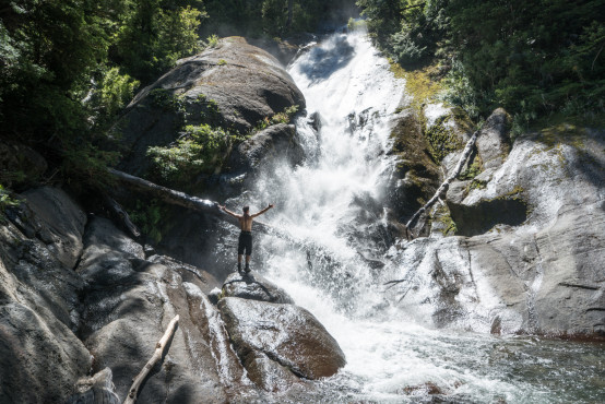 Nadav in awe facing a waterfall from Huerquehue national park, Pucon, Chile