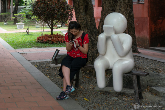 In a park, in Tainan, this ironic image reflects how addicted we could be with our mobile phones nowadays. :-)
